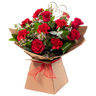 Smooch - 6 red roses and 6 red carnations with choice filler and foliage in a hand-tied or arrangement  in Oasis and presented in a gift bag or box.